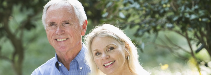 Senior couple in the park smiling couple