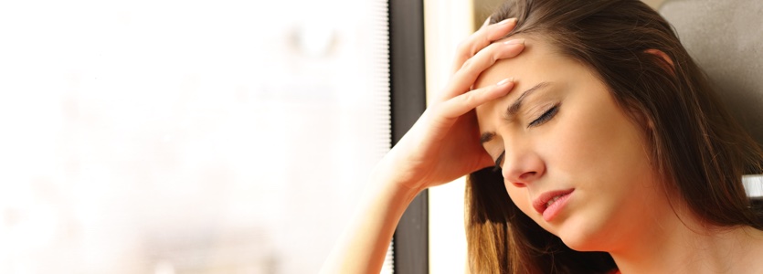 Passenger feeling dizzy in a train travel woman